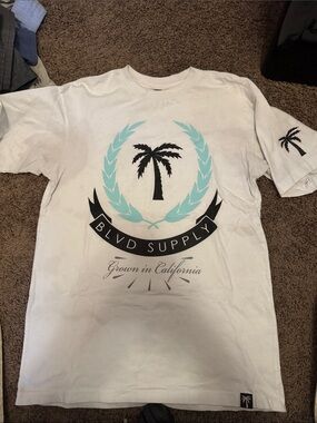 BLVD White Tee with Black Palm and Light Blue Laurel Graphic